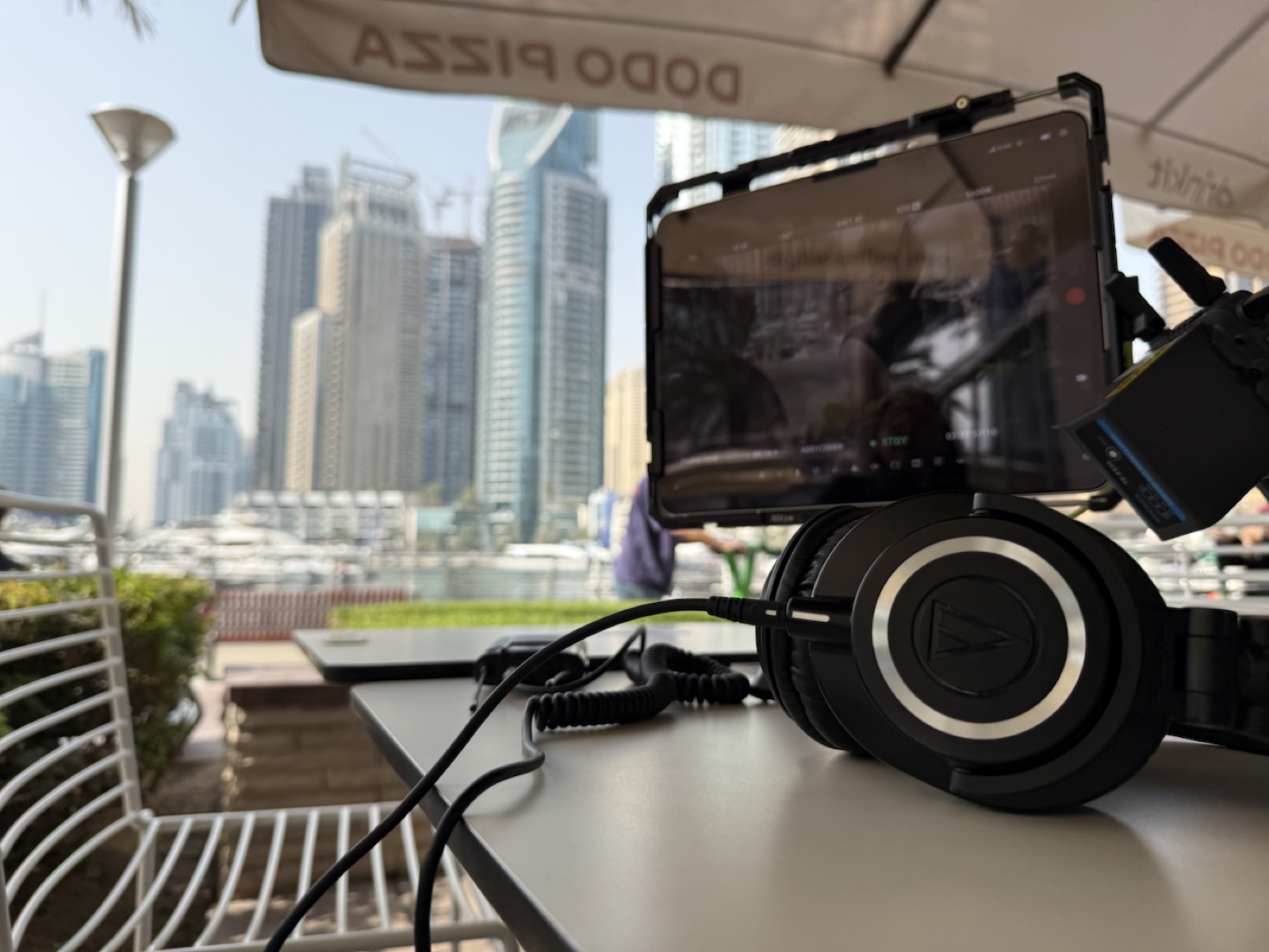 Production monitor and headphones overlooking the set